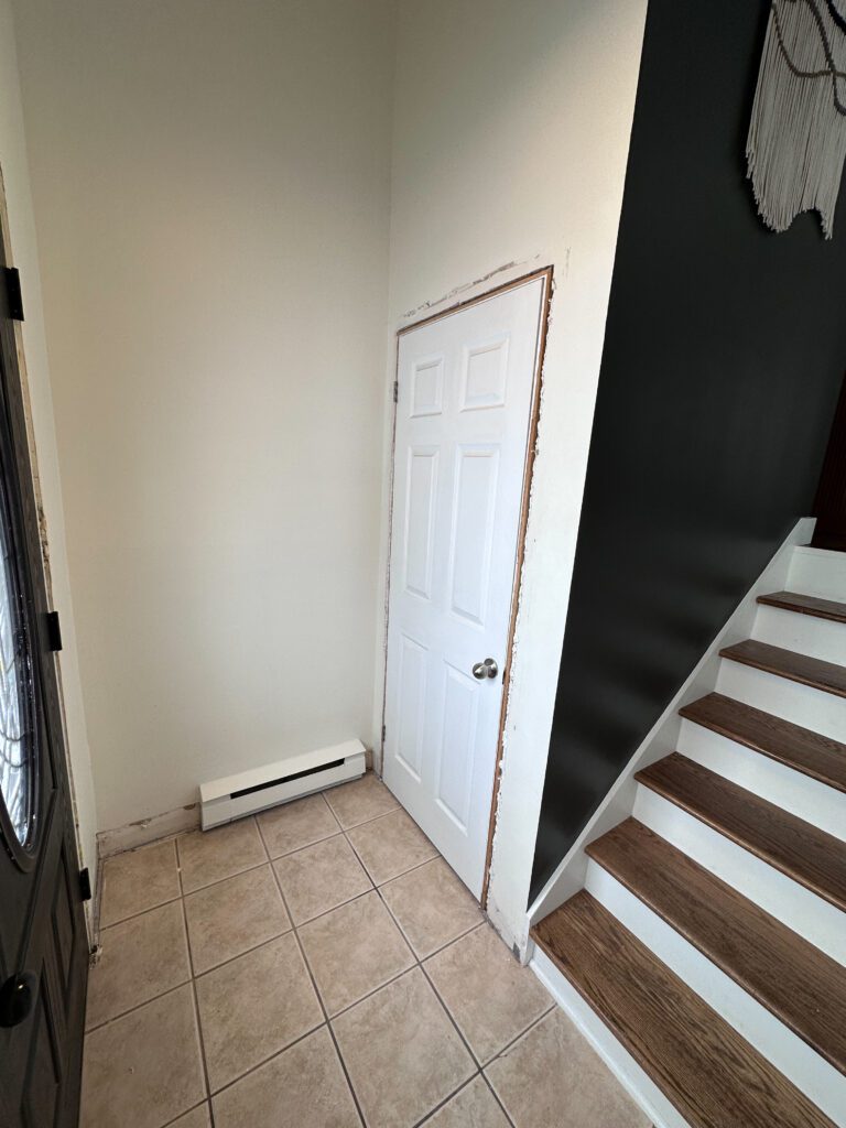 shiplap entryway half wall with reed molding closet door