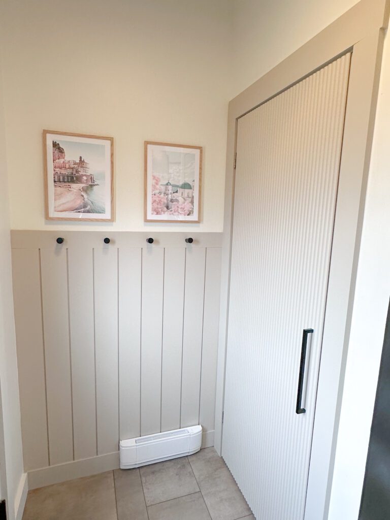 Entryway makeover with shiplap accent wall and reed molding closet door