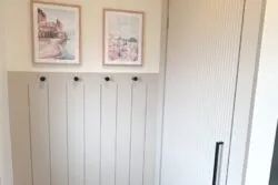 Entryway makeover with shiplap accent wall and reed molding closet door