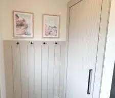 Entryway makeover with shiplap accent wall and reed molding closet door