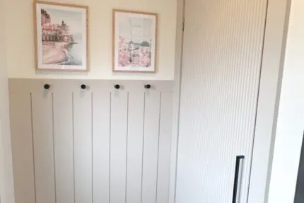 Entryway makeover with shiplap accent wall and reed molding closet door